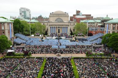 Graduates from all schools attend University Commencement.